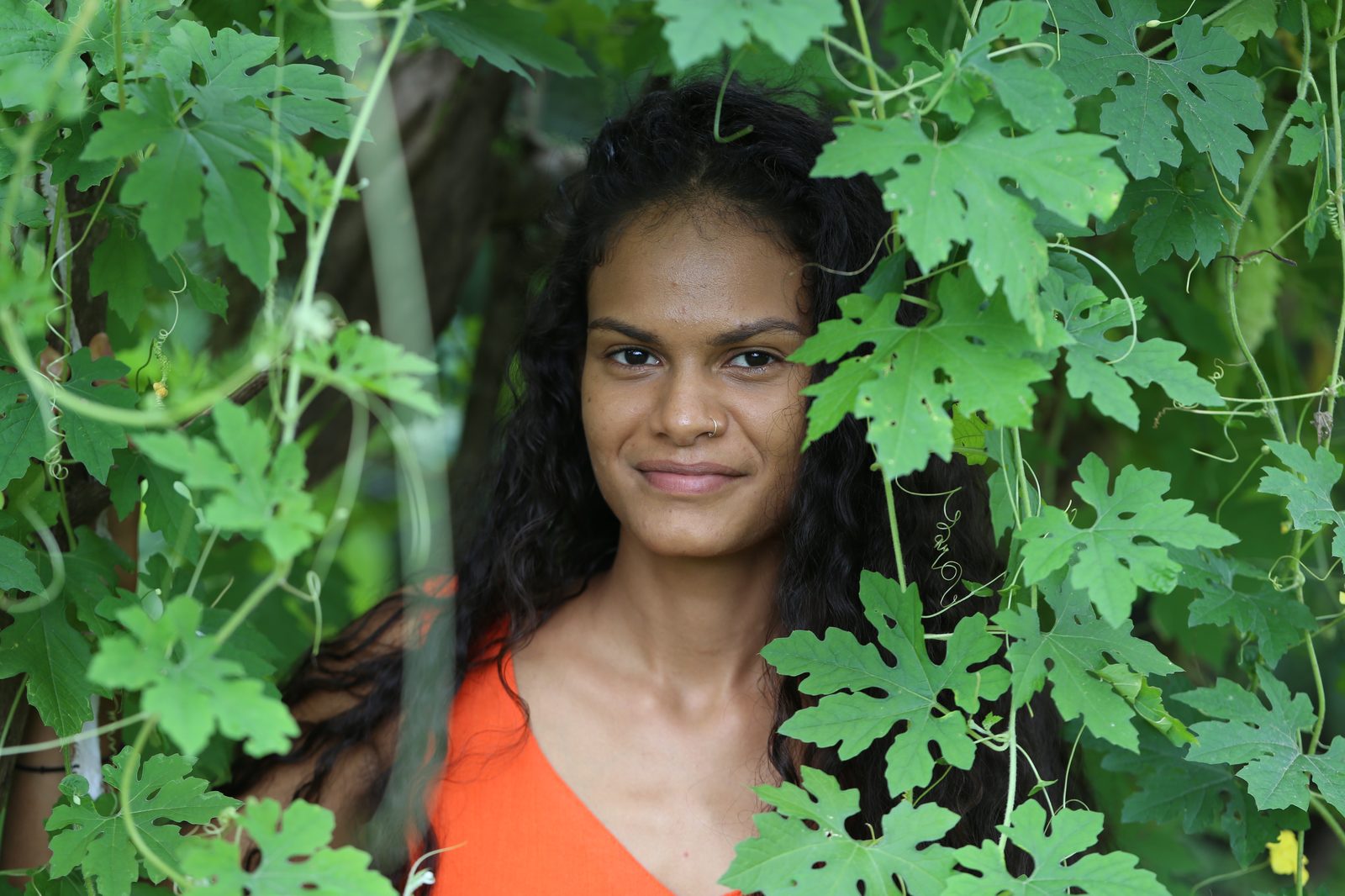 Jeana De Zoysa among leaves